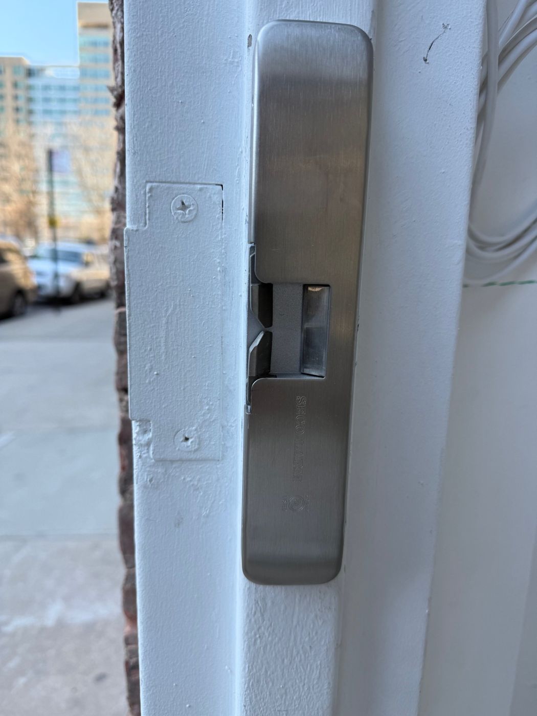 Electric strike installed on a building entrance door frame