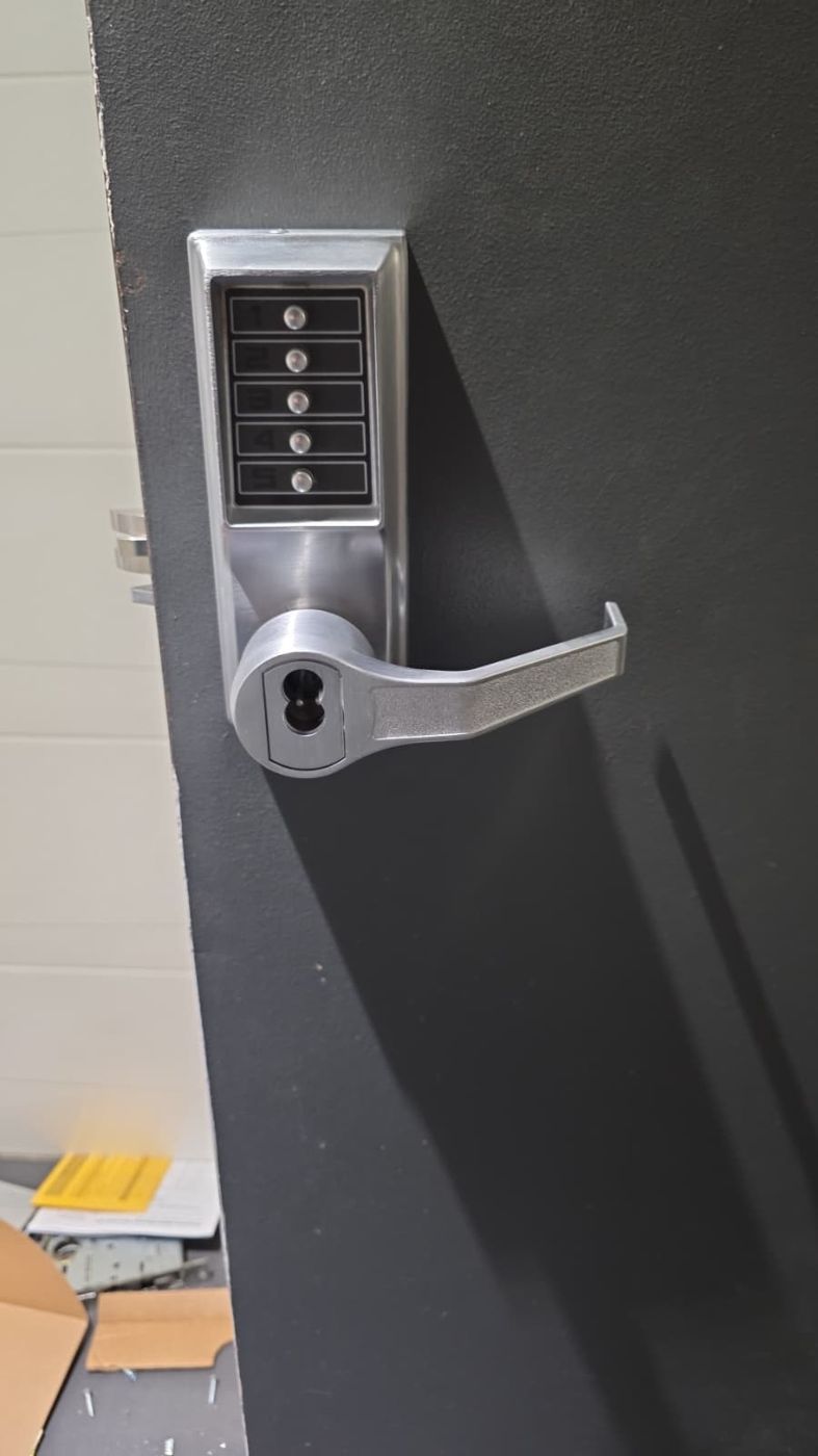 Keypad lever lock installed on a commercial door by Locksmith Plus